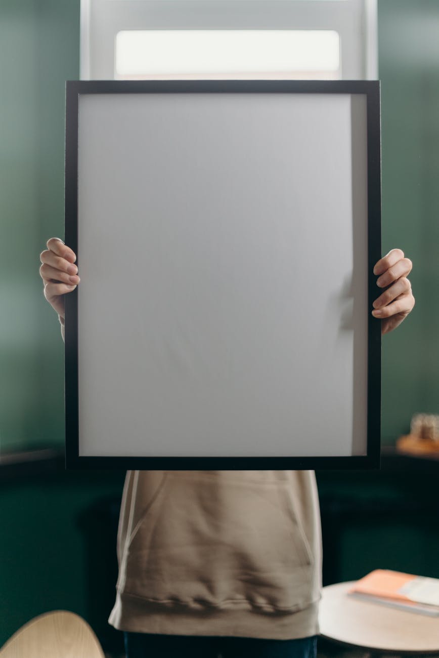 person holding white printer paper